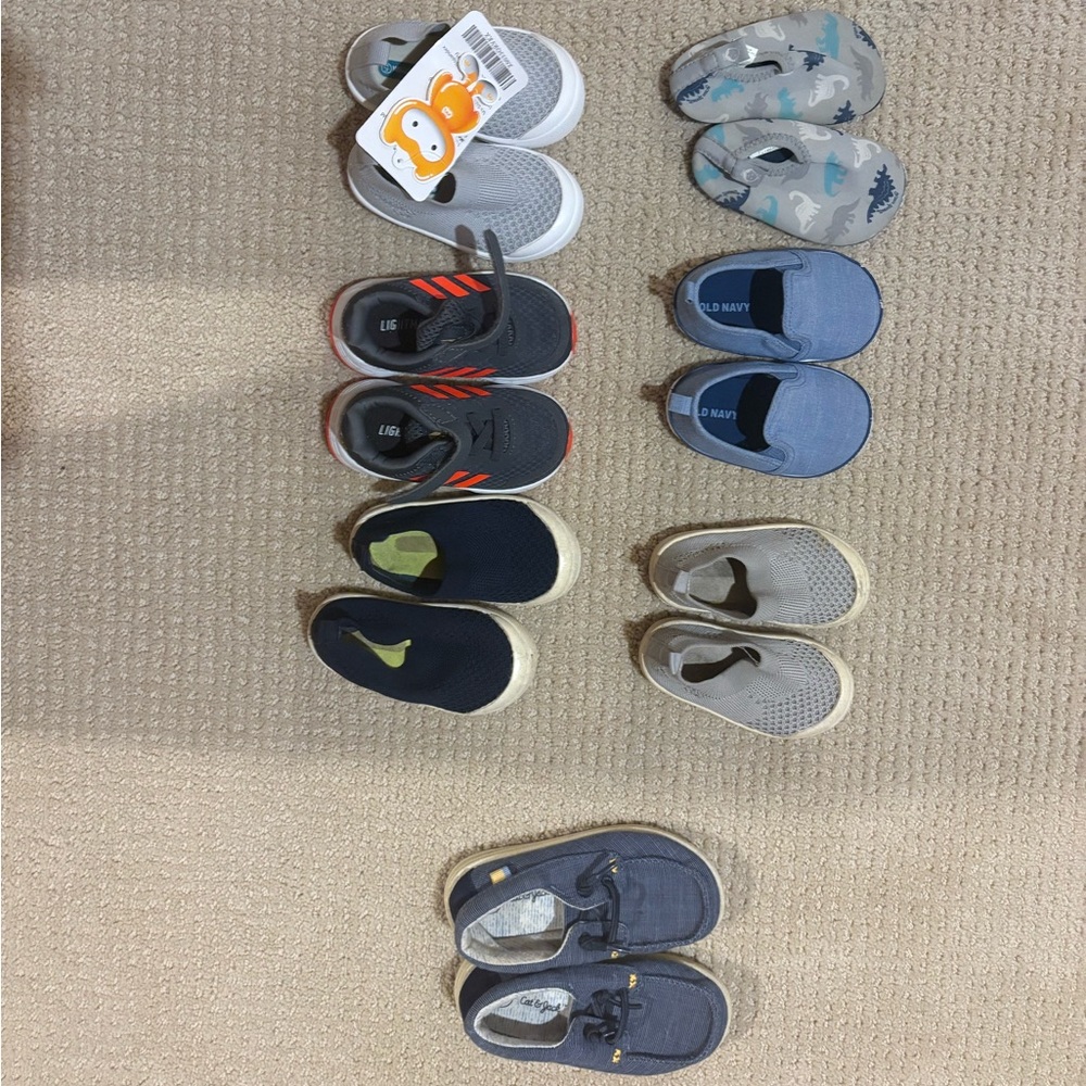 Set of 7 baby walker shoes . 3 in size 4 3 includes size 5 and one in size 8.